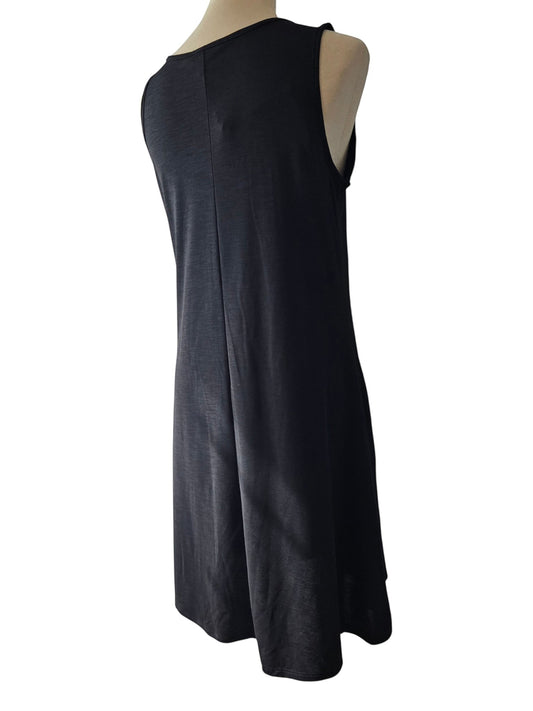Birds of a Feather Boutique & Soy Wax Candle Company black sleeveless tank dress with a relaxed swing silhouette.