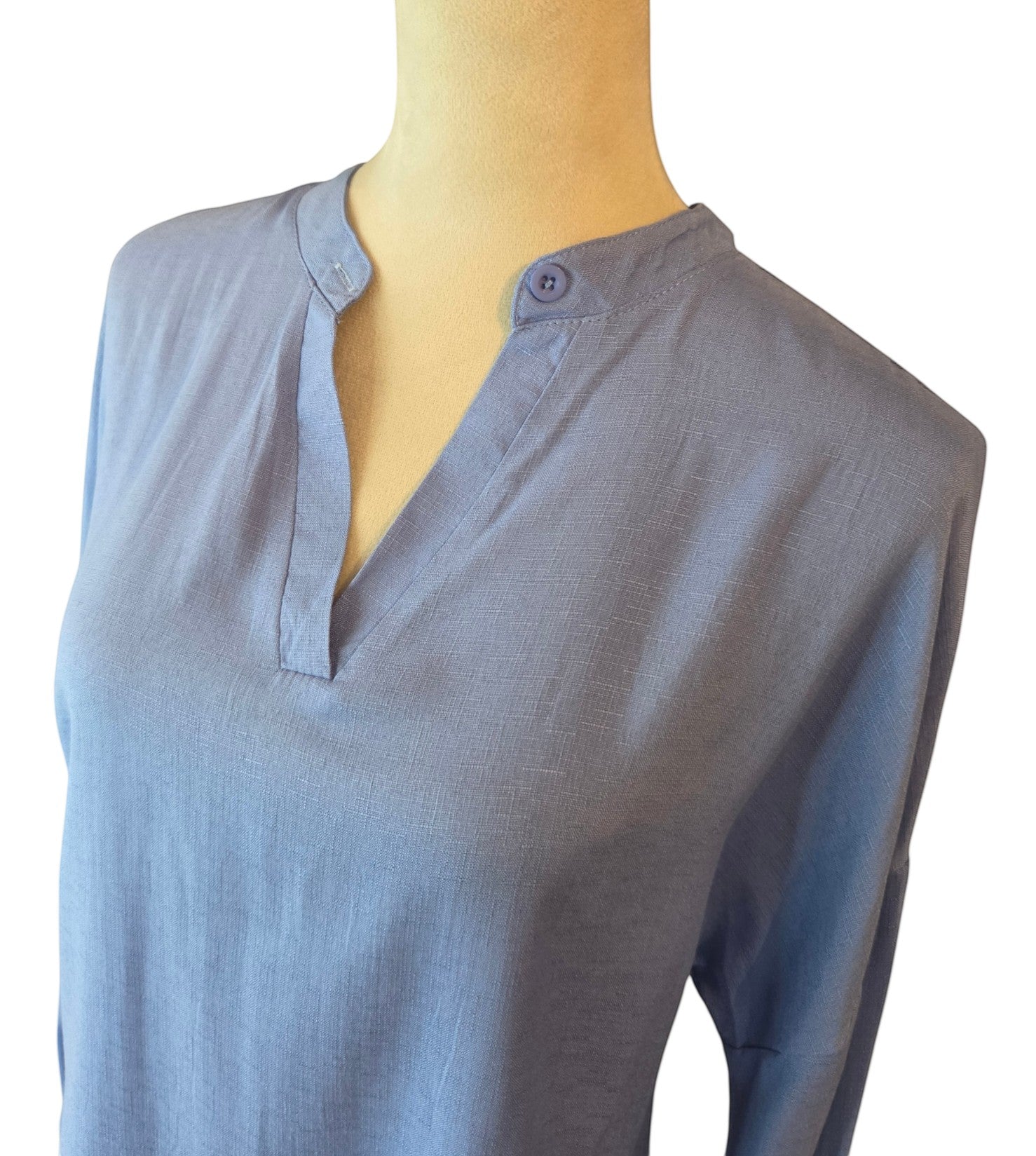 Birds of a Feather Boutique & Soy Wax Candle Company blue long sleeve tunic with a split neck and button detail.