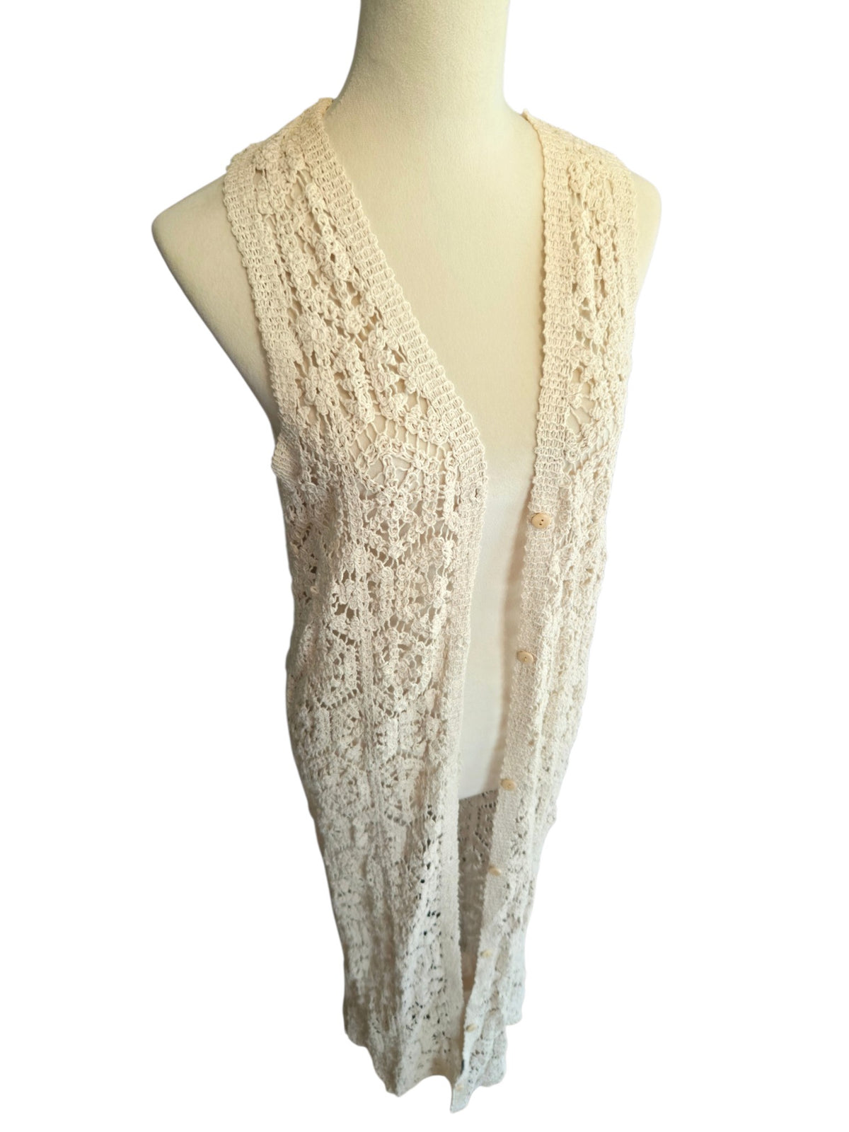 Birds of a Feather Boutique & Soy Wax Candle Company cream longline crochet vest with floral pattern and front buttons