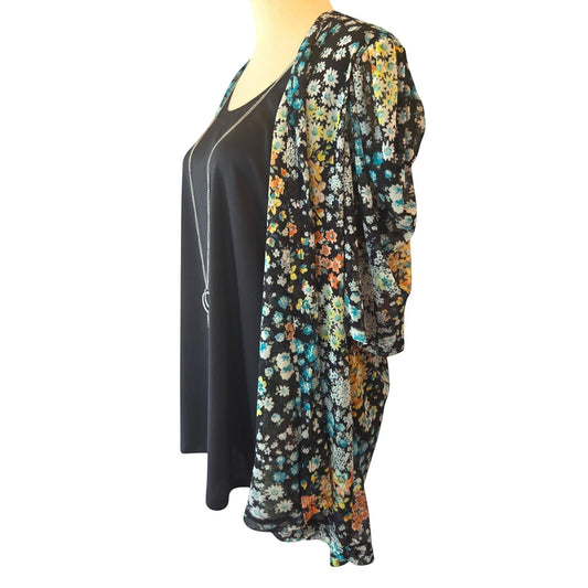 Birds of a Feather Boutique & Soy Wax Candle Company floral one-piece blouse with black tank and included necklace.
