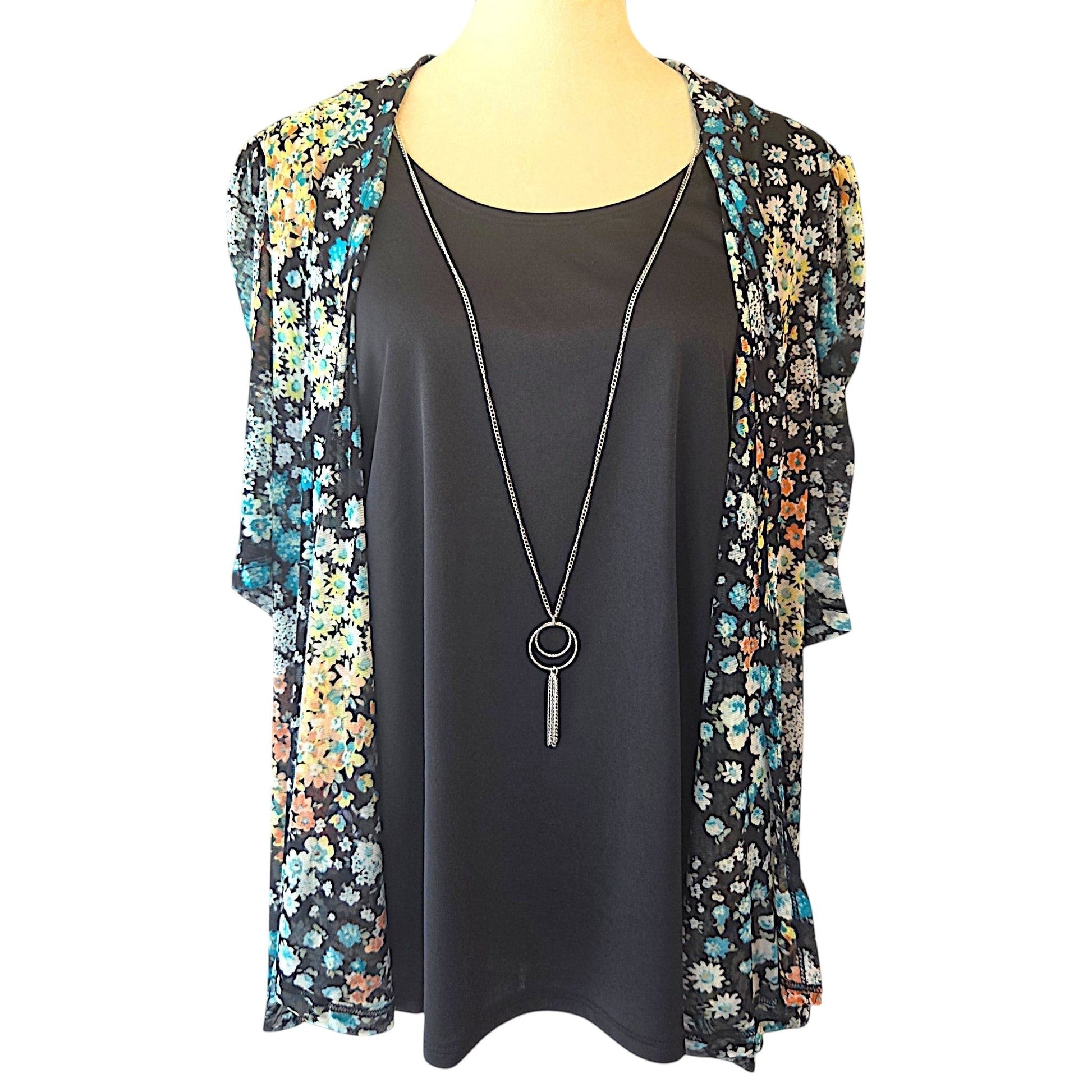Birds of a Feather Boutique & Soy Wax Candle Company ditzy floral layered blouse with black tank and silver necklace